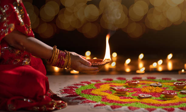 istock Traditional diya lamps lit during diwali celebration 1420633233