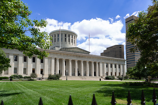 The Ohio Statehouse and accompanying park, located in Columbus, Ohio. Pictured  on a bright, sunny day.