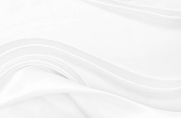 istock White gray satin texture that is white silver fabric silk background with beautiful soft blur pattern natural. 1420641370
