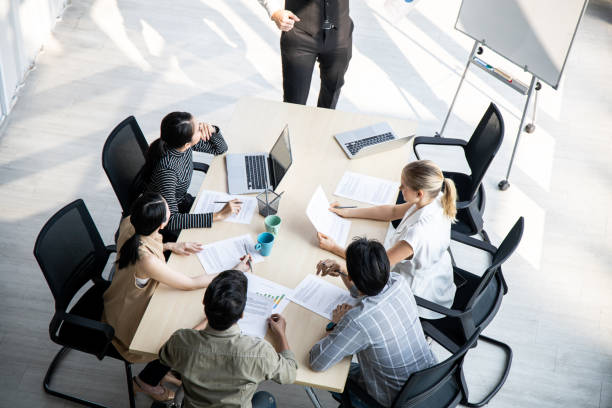 istock Top view of team meeting to analyze assignments. 1420644917