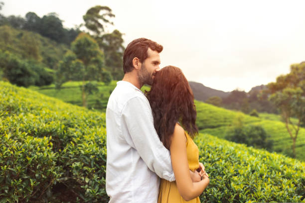 Couple of Travelers in Love in Front of Nature Background Tea Plantations Landscape stock photo