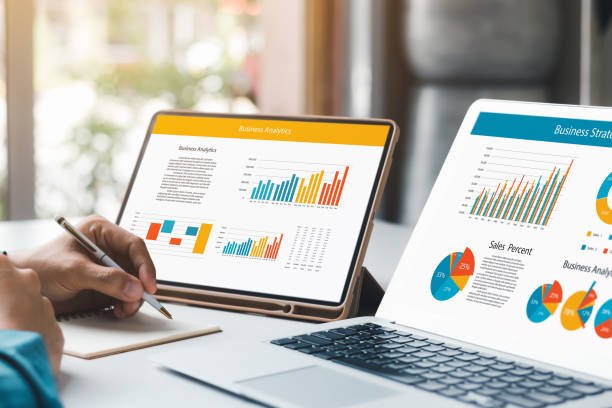 istock Businessman analyzing company's financial balance sheet working with digital augmented reality graphics. Businessman calculates financial data for long-term investment. 1420649809