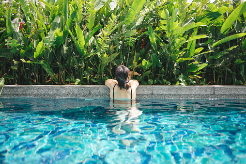 Luxury daily lifestyle businesswomen morning routine at swimming pool in Bangkok city