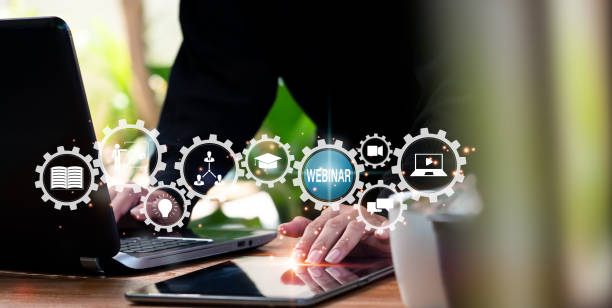 istock The concept of e-learning. Webinars are used for online education, conferences, courses, and meetings. To join, enter, see a live broadcast, person presses button. Technology for online communication. 1420652950