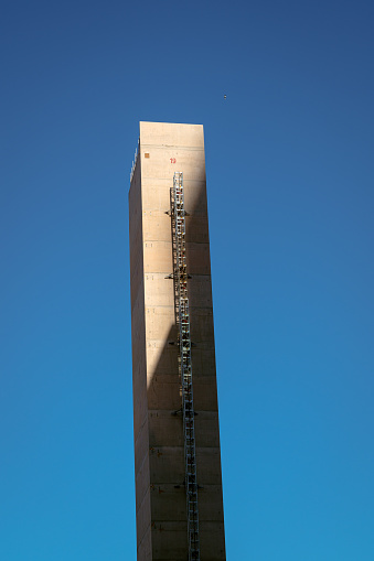 A pillar on an construction site covered by a shadow
