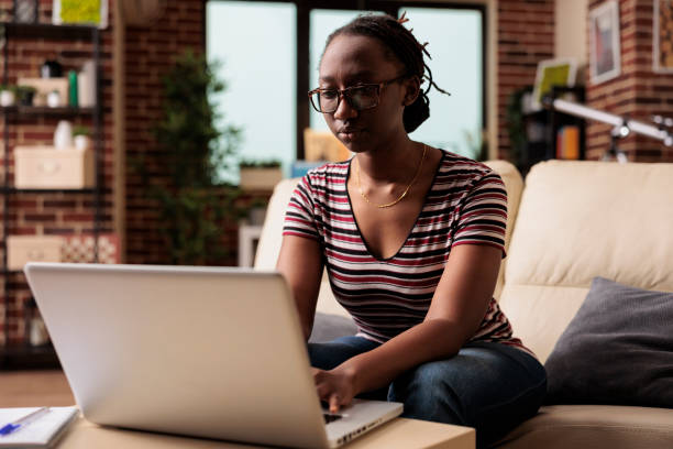 istock Remote student attending online courses class, typing on laptop 1420661851