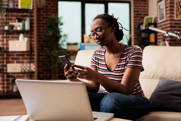 istock Freelancer holding smartphone, typing message, chatting in social network 1420661878