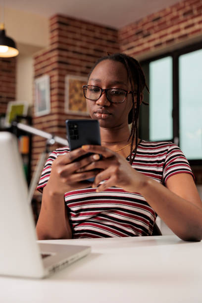 istock Freelancer sending text messages on smartphone 1420661988