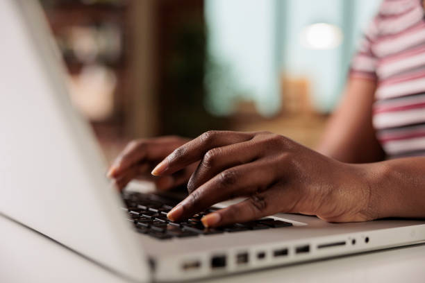 istock Woman hands typing on laptop keyboard close view 1420662056
