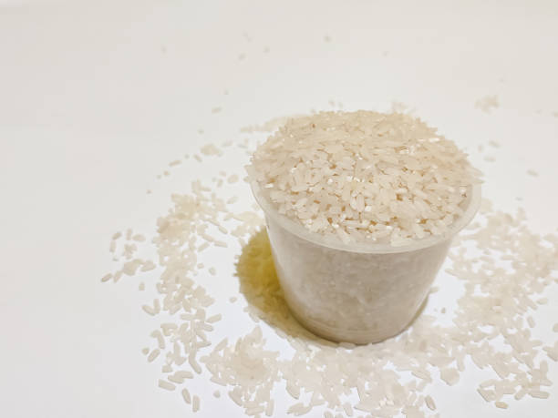 istock rice in receptacle isolated with white background 1420663283