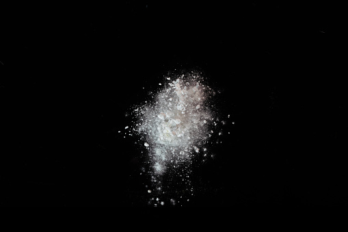 colorful powder explode on black background captured in high speed