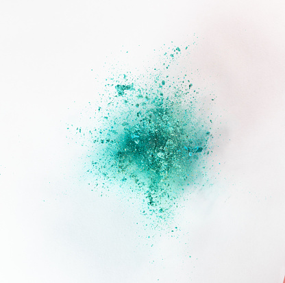 colorful powder explode on white background captured in high speed