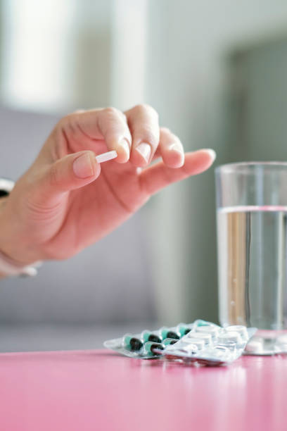 istock Woman With Precription Pill In her Hand 1420667455