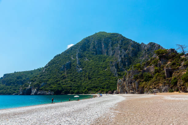 The coast of the ancient city of Olympos Beach at Cirali, the Turkish Riviera (Turkey) cirali stock pictures, royalty-free photos & images