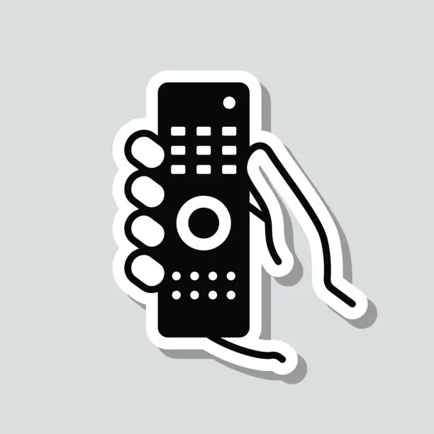 Vector illustration of Hand holding remote control. Icon sticker on gray background