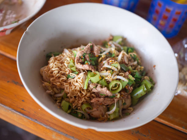 istock Thai Noodle beef is very delicious on wood table 1420678055