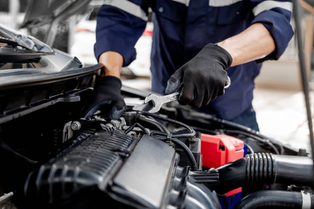 istock Car care maintenance and servicing, Close-up hand technician auto mechanic using the wrench to repairing change spare part car engine problem and insurance service support. 1420678609