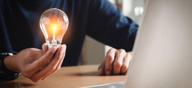 istock Close up hand choose light bulb or lamp with bright for human resources or leadership and creativity thinking idea motivation or vision and knowledge learning. 1420678734