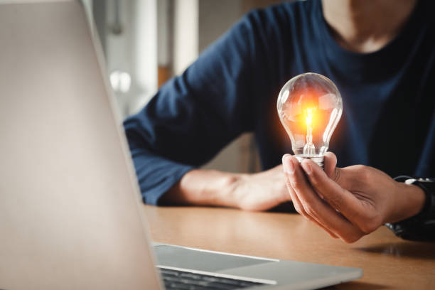 istock Close up hand choose light bulb or lamp with bright for human resources or leadership and creativity thinking idea motivation or vision and knowledge learning. 1420678735
