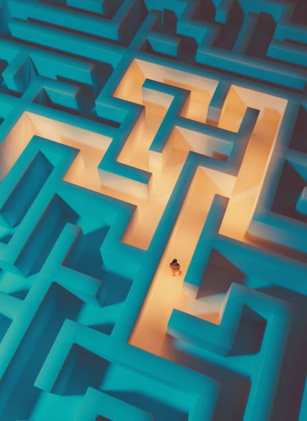 Drone view of woman trapped inside a maze while trying to get out stock photo