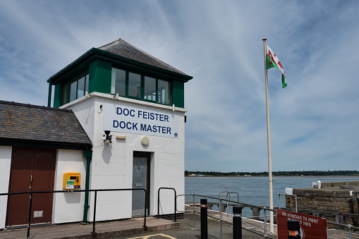 Caernarfon, UK- July 11, 2022:  The Dock Master building  in Caernarfon in North Wales