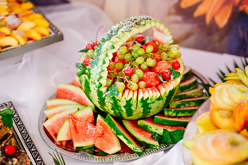 Authentic buffet, assorted fresh fruits, grapes and watermelon. Design creative menu