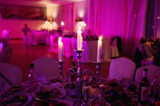 istock Candles creating a fairy atmosphere on a wedding party on blurre 1420680641