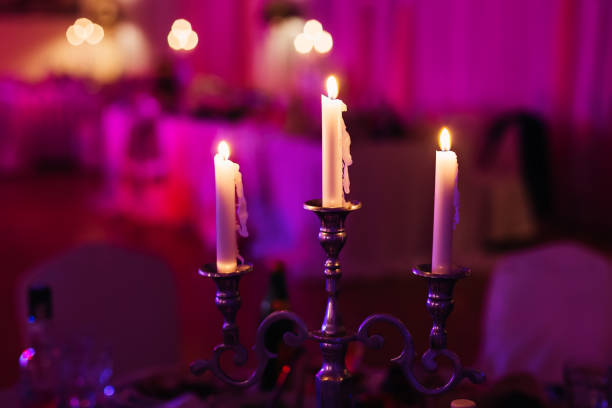 istock Three candles lighting in a luxury restaurant on an official eve 1420680662