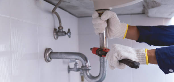 istock Plumber fixing white sink pipe with adjustable wrench. 1420680746