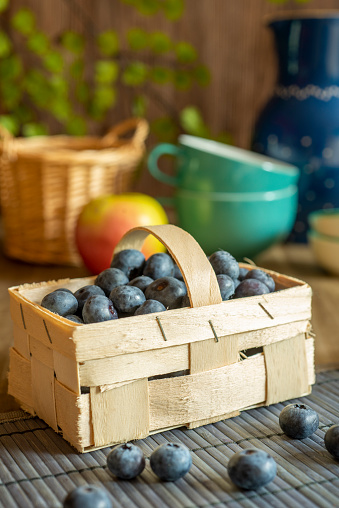 Blueberries in a basket on a table with decoration