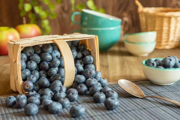 Blueberries in a basket on a table with decoration