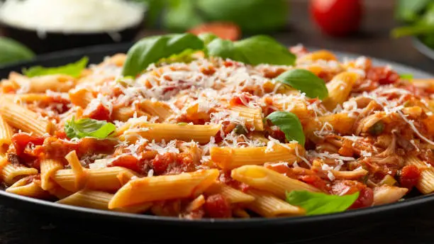 JackFruit pasta with garlic, olives, capers, tomato and cheese. Healthy vegan, diet food.