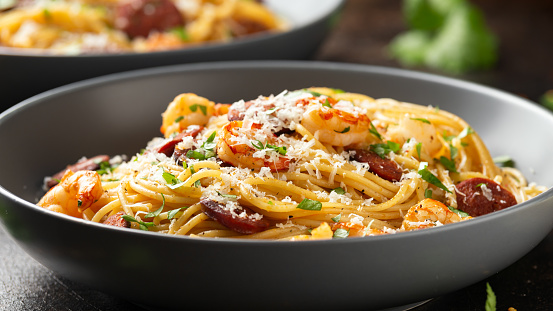 Prawn and chorizo pasta with cheese and herbs.