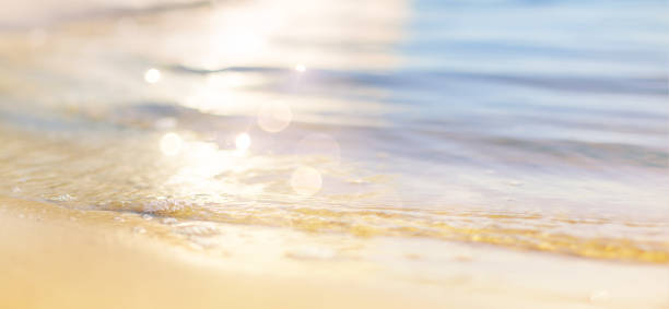 Abstract beautiful sandy beaches sunrise or sunset  background with crystal clear waters of the sea and the tropical  lagoon.
