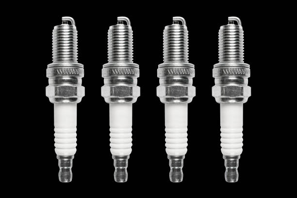 istock Macro shot of spark plug isolated on black background. A spark plug for an engine isolated with clipping path. Quality spare parts for car service or maintenance 1420692070