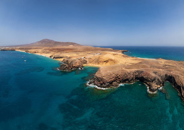 Aerial panorama of Papagayo Beach (Playa del Papagayo), Lanzarote, Canary islands, Spain. stock photo