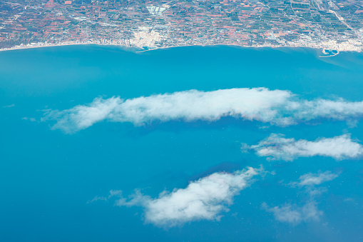 Over the clouds and sea . Spanish coastline view from above