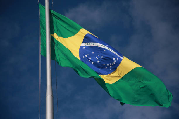 salvador, bahia, brazil - august 25, 2022: Brazil flag on a flagpole of a supermarket in Cabula neighborhood in Salvador city.