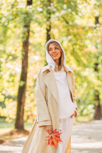 istock Beautiful woman holding leaves 1420698519