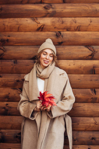istock Beautiful woman holding leaves 1420698650