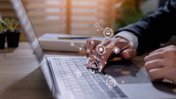 istock businessman working on his laptop in the office, select the icon cloud on the virtual display. Concept digital technology and cloud technology 1420699381