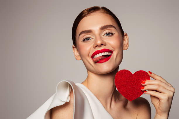 istock Beautiful emotional woman holding present box 1420701351