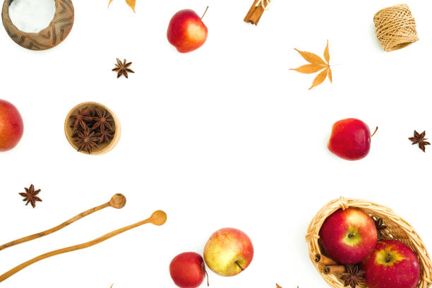 Autumnal food frame composition. Apple, sugar and cinnamon on white background. Flat lay