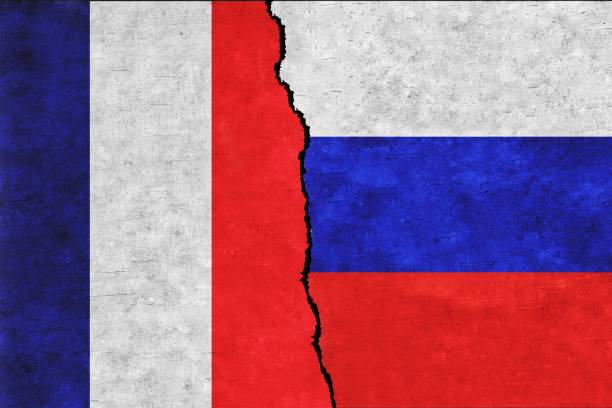 istock Russia and France painted flags on a wall with a crack 1420708594