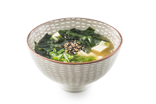 Traditional Japanese soup Miso in bowl isolated on white.