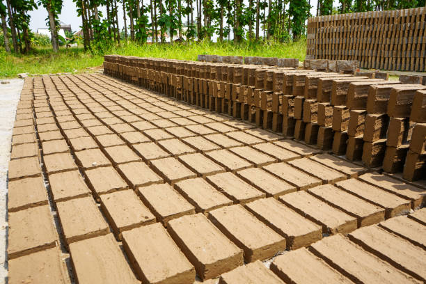 Red bricks from clay. After the clay is molded into bricks, after that it is laid out and dried in the yard in the sun before being burned to make it hard and dry. Pile of making batu bata merah.