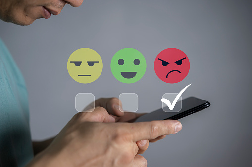 Customer Experience dissatisfied Concept, Unhappy Businessman Client with Sadness Emotion Face on smartphone screen, Bad review, bad service dislike bad quality, low rating, social media not good.