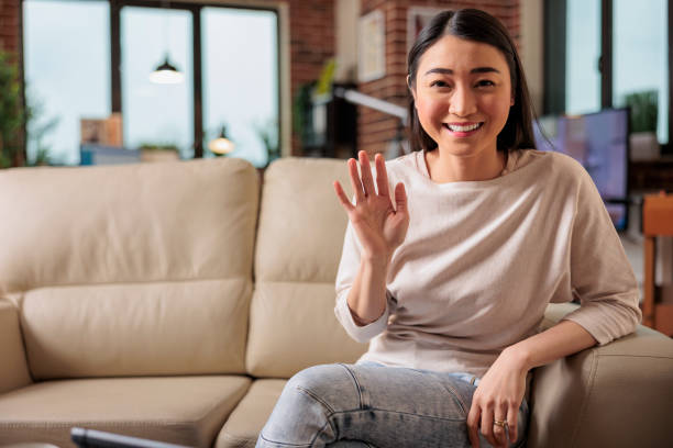 istock Young asian woman talking on phone 1420722539