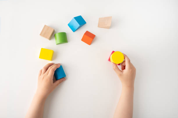 istock child playing with colourful educational toy blocks 1420724164
