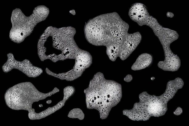 istock Top view, liquid white foam from soap or shampoo or shower gel. Abstract bubbles. isolated on a black background 1420724325